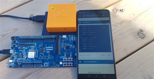  An image of an orange Thingy:91, an nRF5340dk, and a smartphone showing messages sent from the Thingy:91 to nRF Cloud. Messages are on JSON format and has five entries per received message.